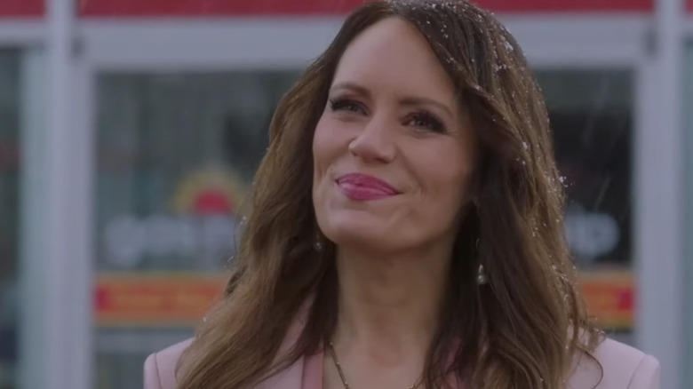 Emily Swallow's Amara smiling with snow in her hair on Supernatural