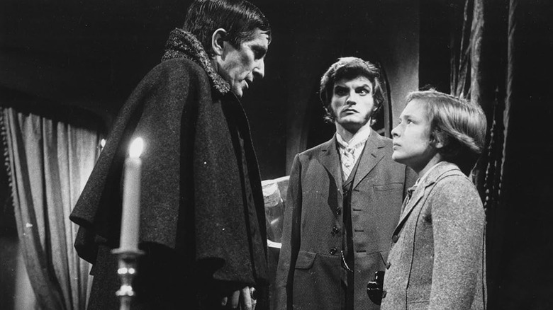 Barnabas Collins (Jonathan Frid) speaks with David Collins (David Henesy) as Quentin Collins (David Selby) watches in Dark Shadows (1966)