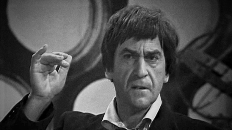 The Second Doctor (Patrick Troughton) holds his hand up in Doctor Who