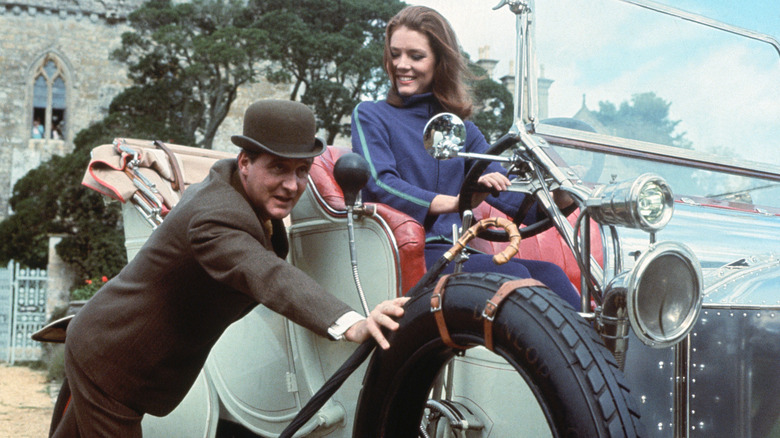 Emma Peel (Diana Rigg) in a car looking at John Steed (Patrick Macnee) in The Avengers