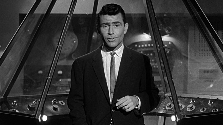 Rod Serling addresses the audience while speaking in front of a futuristic console in The Twilight Zone (1959)