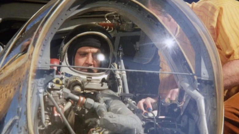 Steve Austin (Lee Majors) sits in a small cockpit in The Six Million Dollar Man