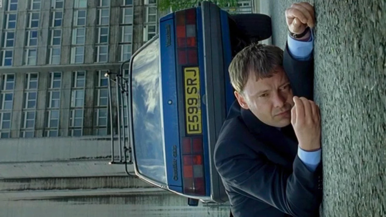 Jon Simm as Sam Tyler, lying on the ground next to his car on Life on Mars