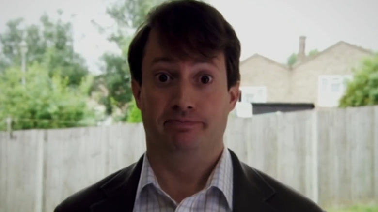 David Mitchell as Mark Corrigan, looking blankly into the camera on Peep Show