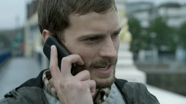 Jamie Dornan as Paul Spector, taking a phone call on The Fall