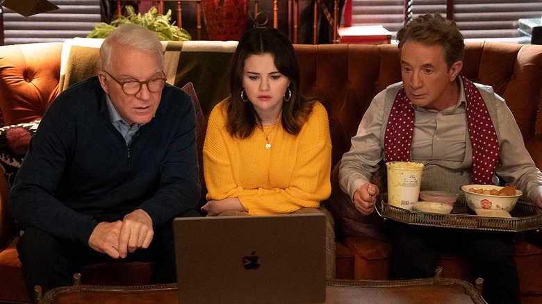 Charles Haden-Savage (Steve Martin), Mabel Mora (Selena Gomez), and Oliver Putnam (Martin Short) stare intently at a laptop while seated on a couch on Only Murders in the Building
