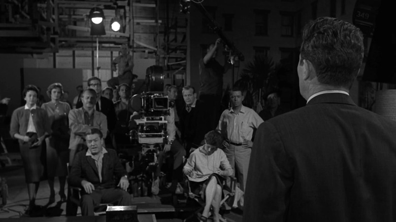 Howard Duff as Arthur Curtis, suddenly confronted by a movie crew that appeared out of nowhere, in The Twilight Zone episode A World of Difference