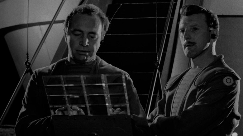 Sheldon Allman and Bill Walsh as the real aliens, observing their handiwork in The Twilight Zone episode The Monsters Are Due on Maple Street.