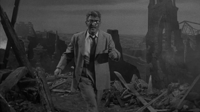 Burgess Meredith as Henry Bemis emerges into atomic rubble in The Twilight Zone episode Time Enough at Last
