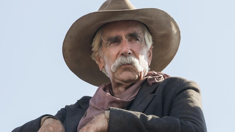 hea Brennan (Sam Elliott) stands sternly in 1883