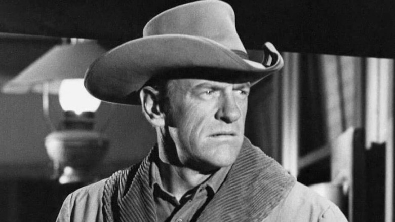 Matt Dillon (James Arness) looks sternly to his left in Gunsmoke