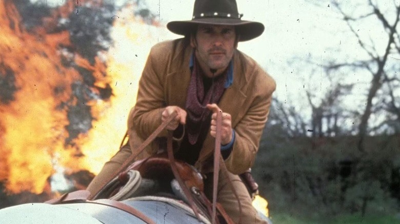 Brisco County, Jr. (Bruce Campbell) rides a rocket in The Adventures of Brisco County, Jr.