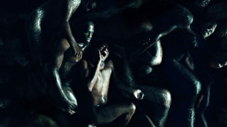 Mark Rendall as Roland Umber awakens next to corpses on Hannibal