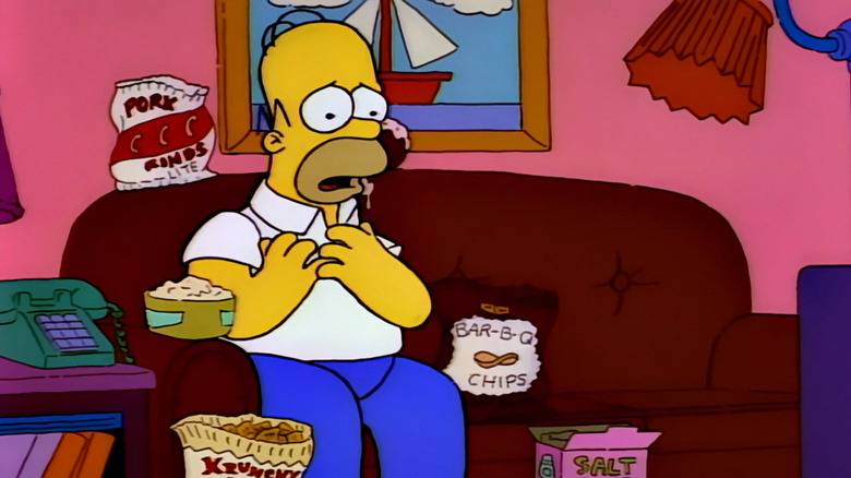 Homer Simpson surrounded by chips on The Simpsons