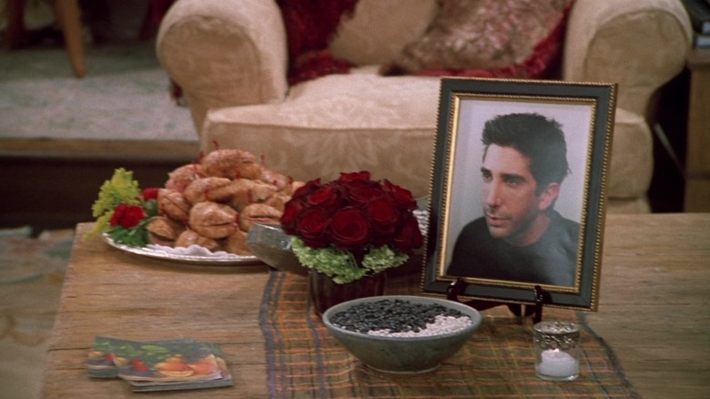 A framed image of David Schwimmer as Ross, posed for a memorial service on Friends