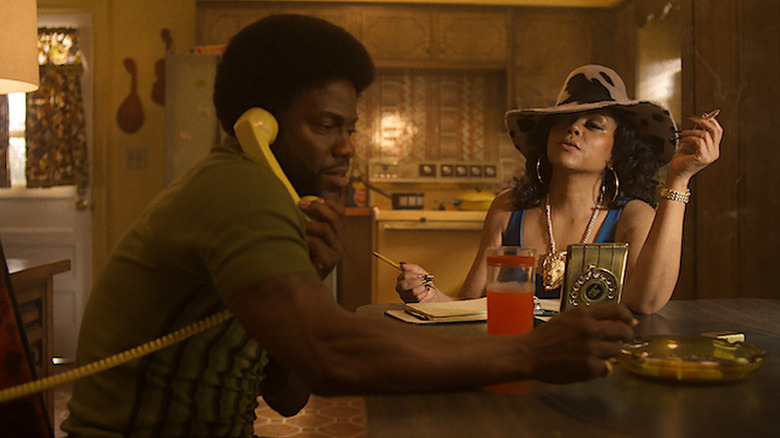 Chicken Man (Kevin Hart) talks on a phone while Sweets (Taraji P. Henson) watches him smoking a cigarette in Fight Night: The Million Dollar Heist
