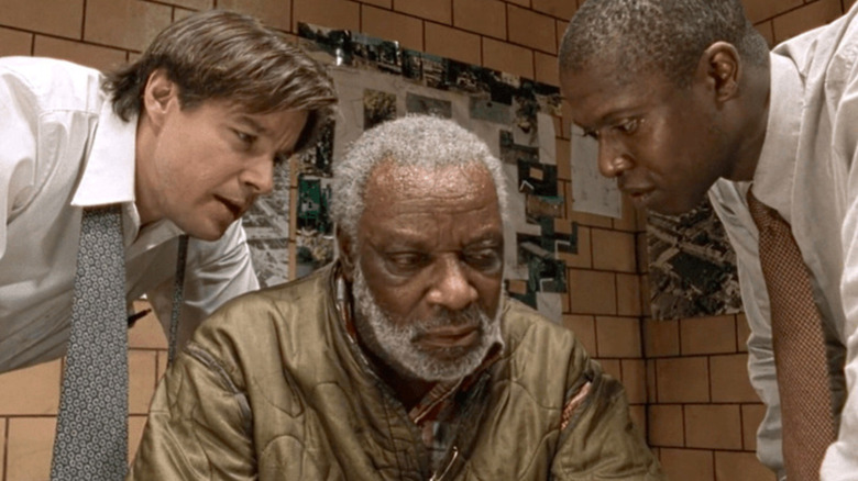 Frank Pembleton (Andre Braugher) and Tim Bayliss (Kyle Secor) interrogating Risley Tucker (Moses Gunn) in Homicide: Life on the Street