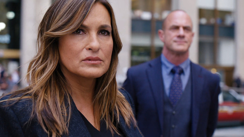 Olivia Benson (Mariska Hargitay) and Elliot Stabler (Christopher Meloni) stand in a city street in Law & Order: Special Victims Unit
