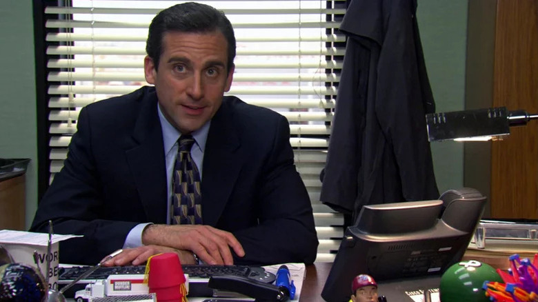 Michael Scott (Steve Carell) looks up from his desk in The Office