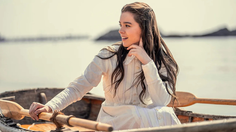 Emily Dickinson (Hailee Steinfeld) smiles while sitting in a rowboat on Dickinson