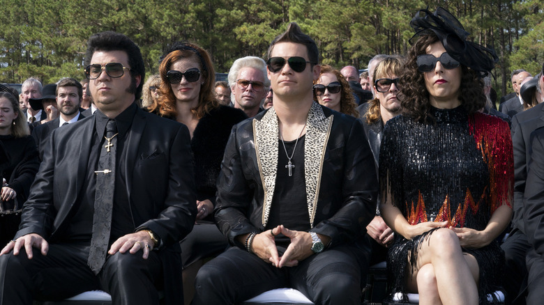 Jesse (Danny McBride), Judy (Edi Patterson), and Kelvin (Adam Devine) at a funeral on The Righteous Gemstones