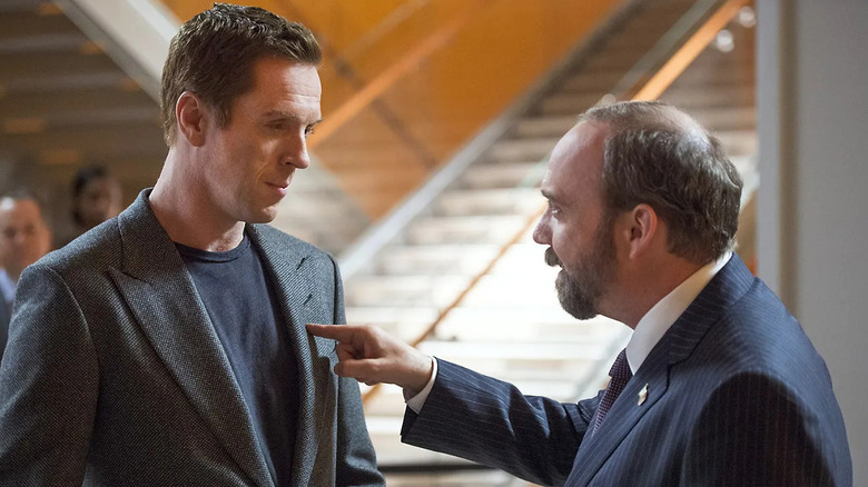 Damian Lewis as Bobby Axelrod, being confronted by Paul Giamatti's Chuck Rhoades on Billions