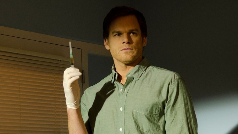 Michael C. Hall as Dexter Morgan, holding a syringe on Dexter
