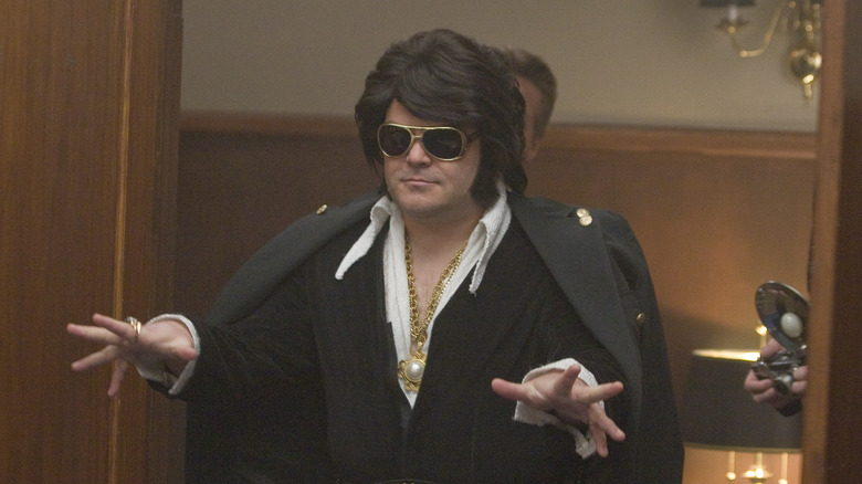Jack Black as Elvis Presley, bursting through double doors on Drunk History