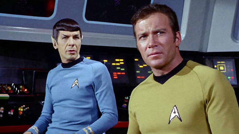 Leonard Nimoy and William Shatner as Spock and Captain Kirk, looking curious on Star Trek