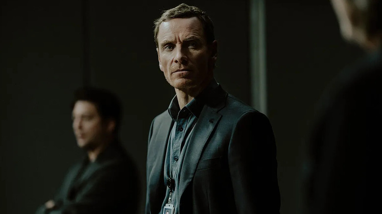 Michael Fassbender as Brandon Colby, scowling at someone on The Agency