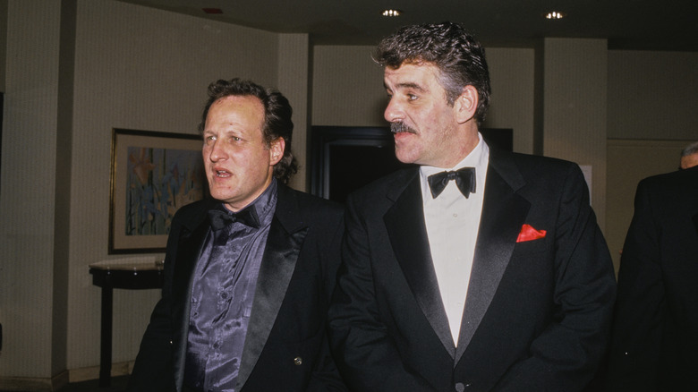 Michael Mann and Dennis Farina wearing tuxedos in the '80s.
