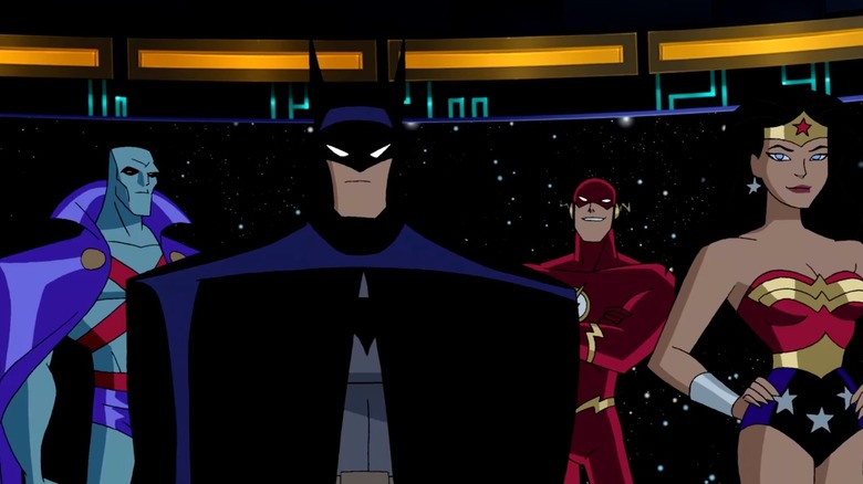 Martian Manhunter, Batman, The Flash, and Wonder Woman standing together in Justice League
