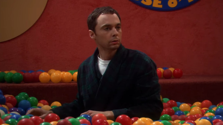 Leonard chases Sheldon around a childrens' ball pit after a stressed out Sheldon melts down over a science problem