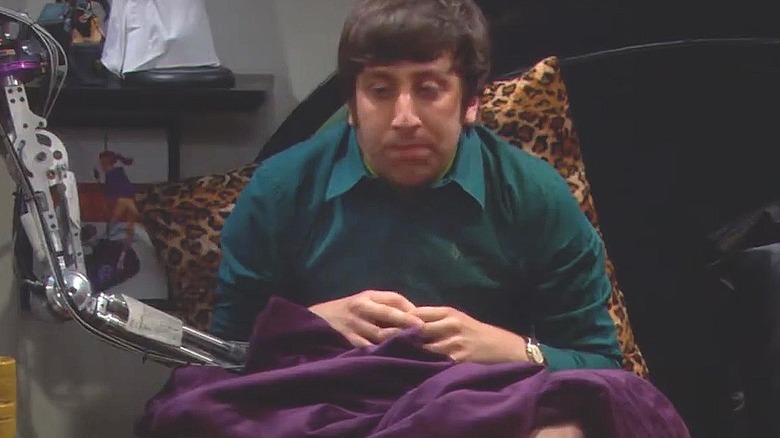 Howard gets his robotic arm and hand stuck in an unfortunate private area