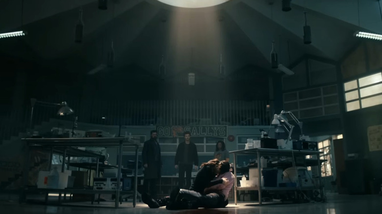 Kimiko cradles a dying Frenchie in front of Butcher, Hughie, and Sage