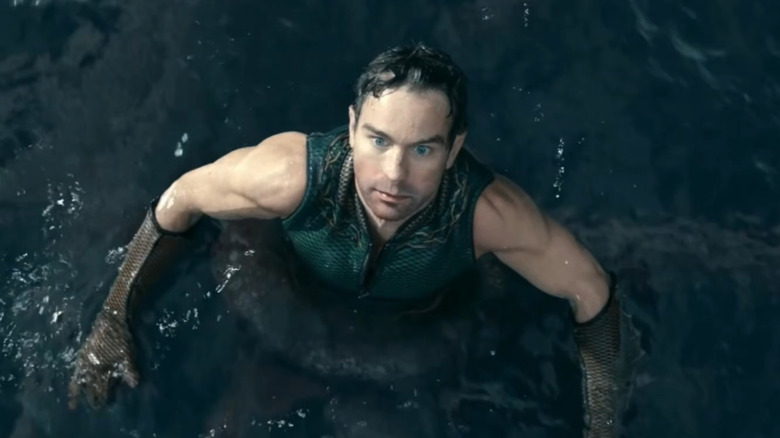 The Deep ensnared by a tentacle in the water