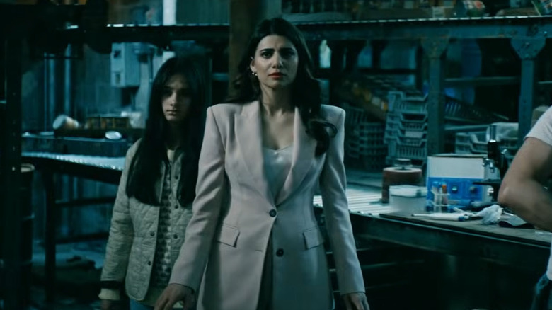Victoria Neuman standing with her daughter and looking worried
