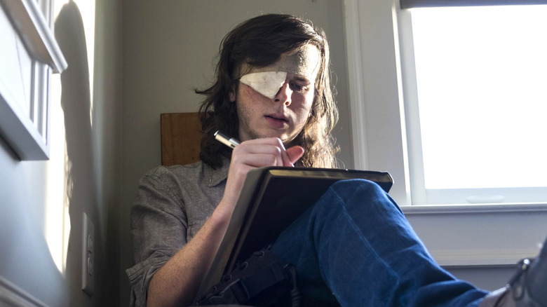 Carl writing his farewell note in The Walking Dead