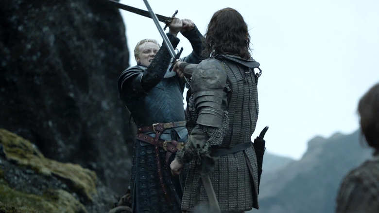 Gwendoline Christie and Rory McCann swordfighting as Brienne of Tarth and The Hound in "Game of Thrones."