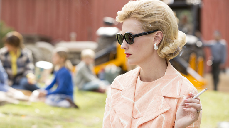 Betty Draper (January Jones) wearing sunglasses and smoking a cigarette on Mad Men