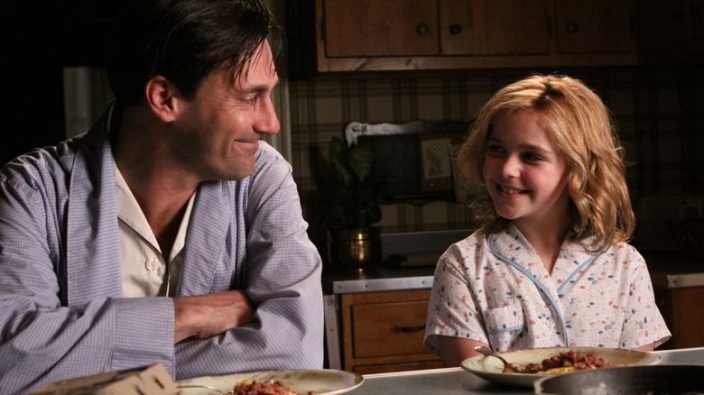 Don Draper (Jon Hamm) smiling at Sally (Kiernan Shipka) in Mad Men