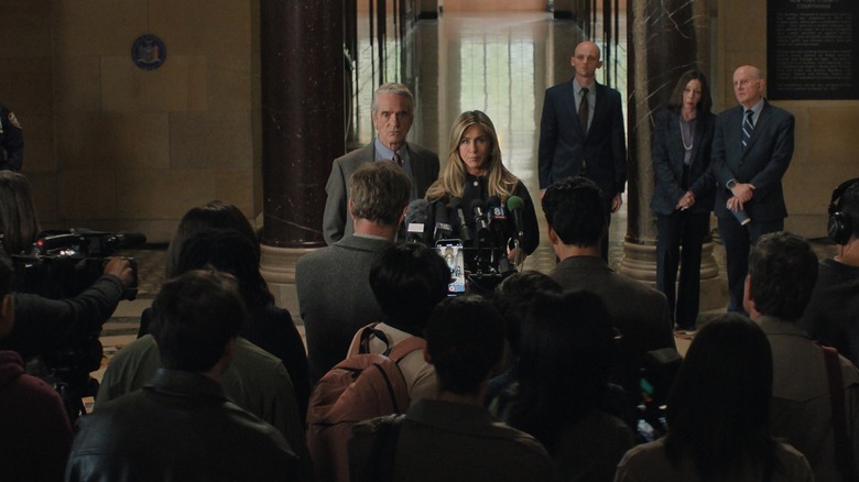Jeremy Irons as Martin and Jennifer Aniston as Alex give a press conference in The Morning Show