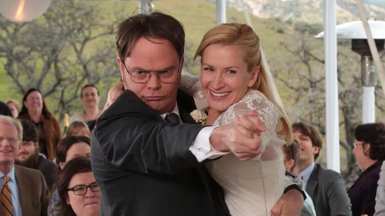 Rainn Wilson and Angela Kinsey as Dwight Schrute and Angela Martin, dancing at their wedding on The Office.