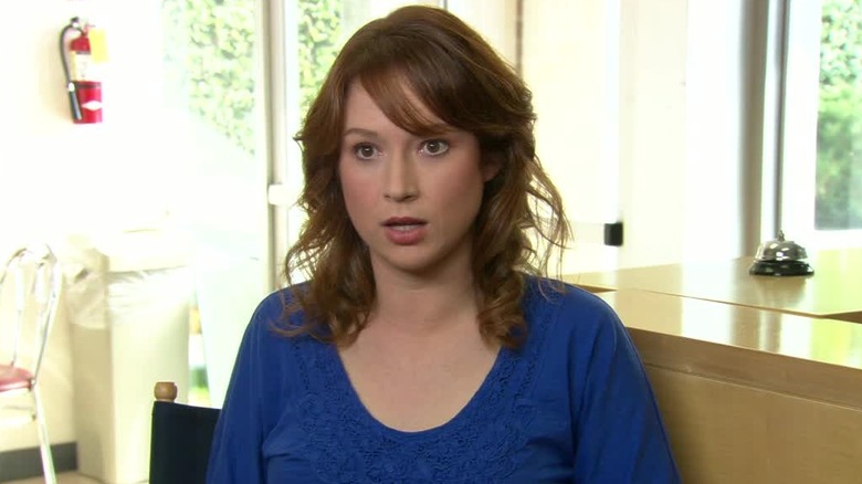 Ellie Kemper as Erin Hannon, giving an interview on The Office.