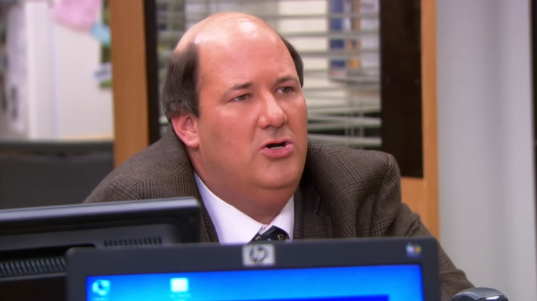 Brian Baumgartner as Kevin Malone, pursing his lips on The Office.