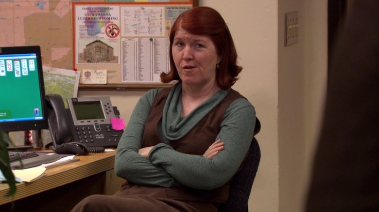 Kate Flannery as Meredith Palmer, crossing her arms on The Office.