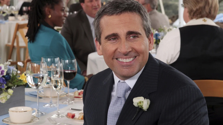 Steve Carell as Michael Scott, smiling at the wedding on The Office.