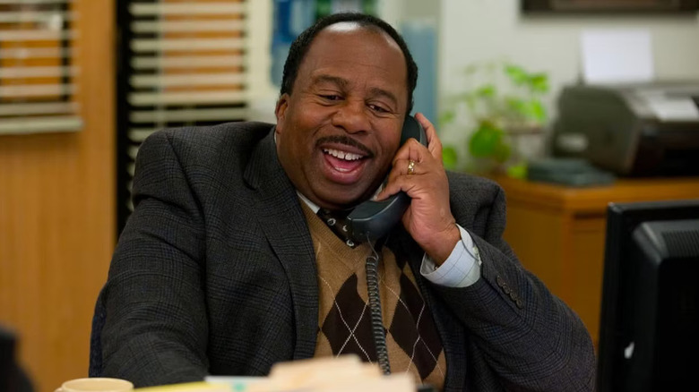 Leslie David Baker as Stanley Hudson, laughing on the phone on The Office.