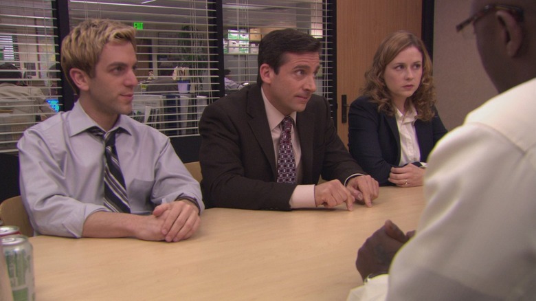 Ryan, Michael, and Pam sit in front of Charles Miner in the conference room on The Office.