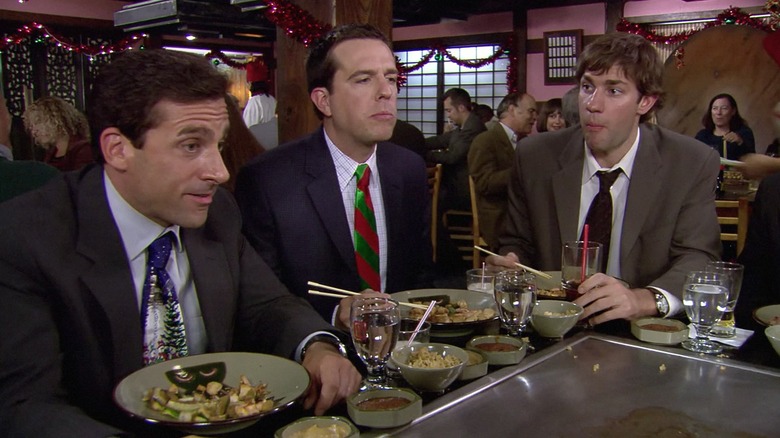 Michael Scott (Steve Carell), Andy Bernard (Ed Helms), and Jim Halpert (John Krasinski) dine at a hibachi grill in The Office